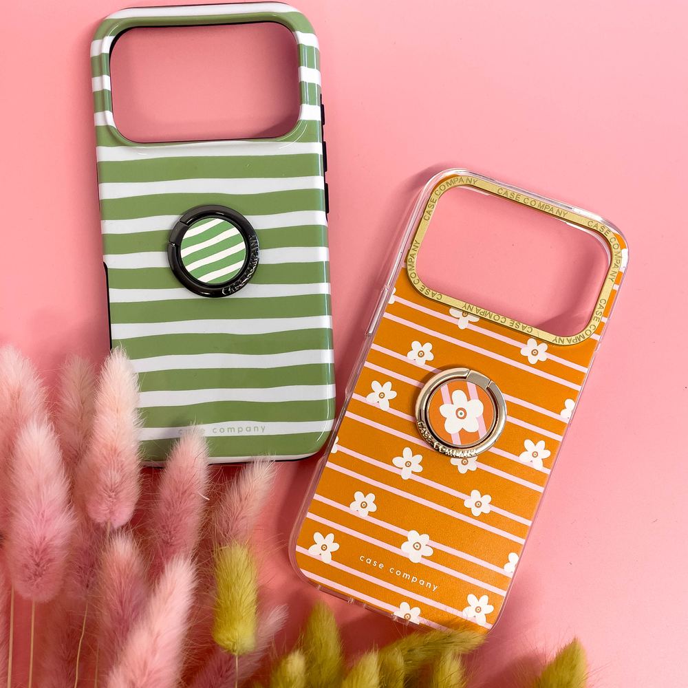 Bagues de téléphone dorée et noire sur des coques à pois et à cercles
